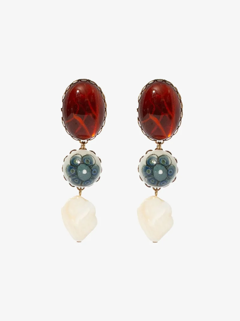 Earrings made up of vintage cabochons, mother-of-pearl beads, and hand-painted ceramic stones