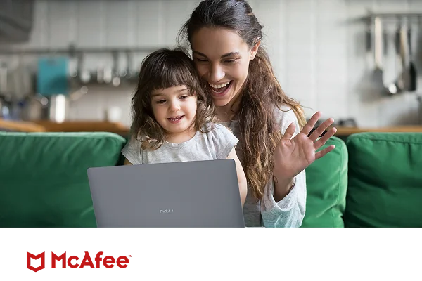A parent and young child enjoying a web call on the parent’s computer, protected by McAfee Plus Premium.