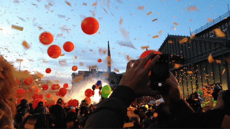 Image description: Crowd at the carnival celebration in Barcelona, Spain.