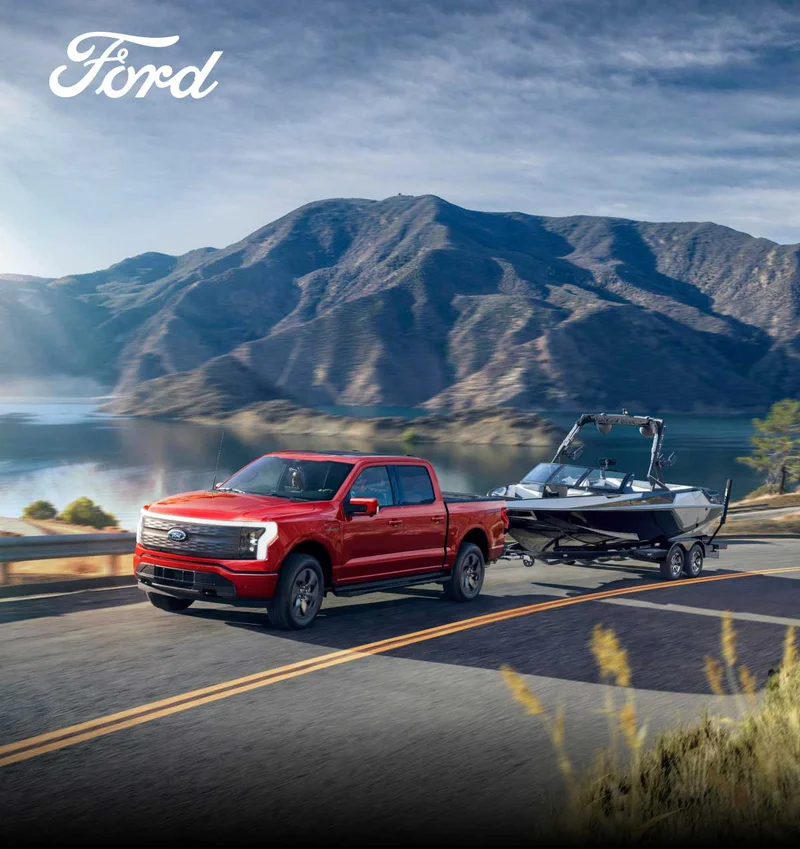 A Ford truck towing a boat.