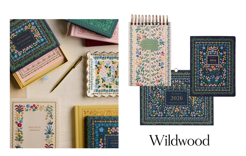 Flora-themed journals, notepads, planner, and 2026 calendar in Wildwood patter, with "Wildwood" text at bottom.
