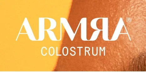 ARMRA Colostrum logo on an orange background.