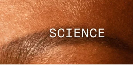 Close-up of skin with the word ‘SCIENCE’ in white text.