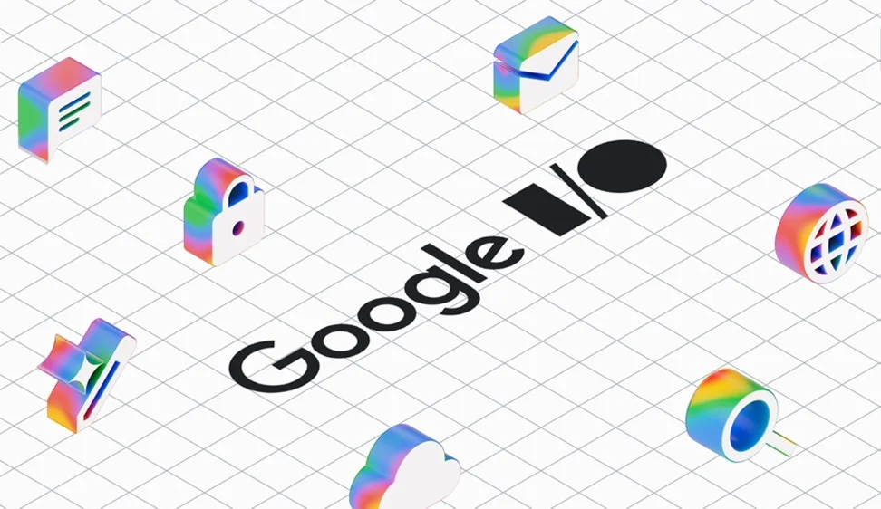 An isometric illustration features Google I/O in black text centered on a white grid. Surrounding the text are colorful, transparent 3D icons representing common digital functions like messaging, email, security, and global connectivity.