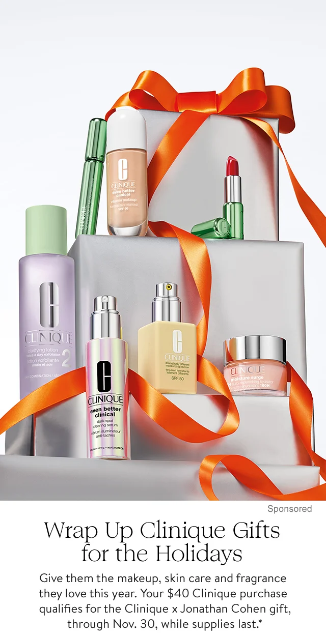 Clinique skin care and makeup items on stacked gift boxes.