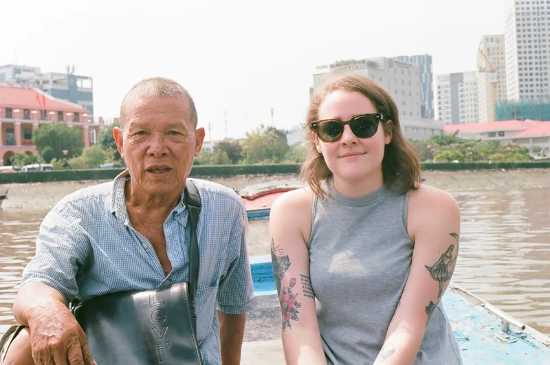 Sara + friend on a boat ride in Vietnam