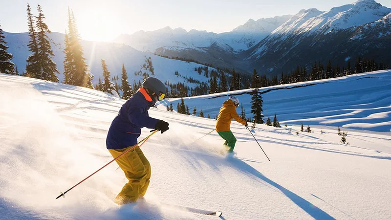 Image description: Couple skiing at Whistler Blackcomb, Canada
