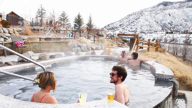 Image description: People soaking at Iron Mountain Hot Springs in Colorado