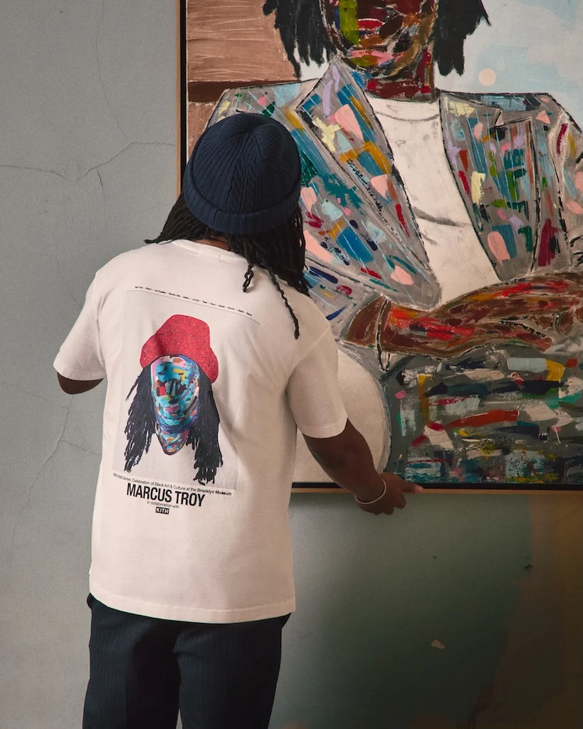Person wearing Kith for the Brooklyn Museum hoodie and beanie