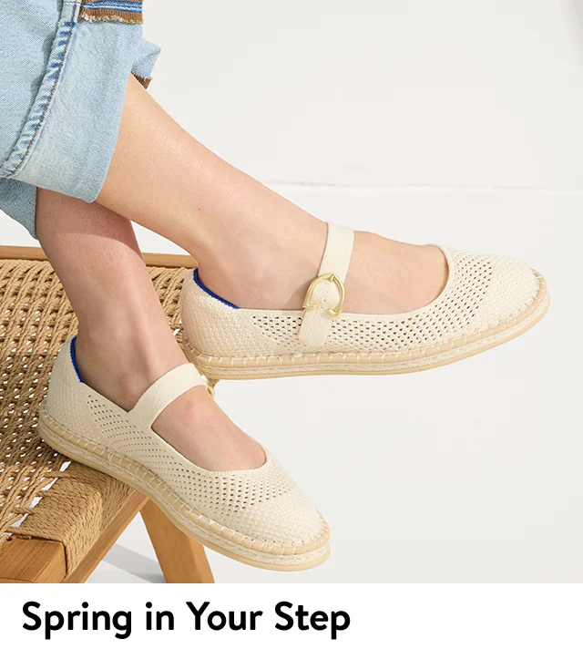 A woman wearing espadrille mary janes.
