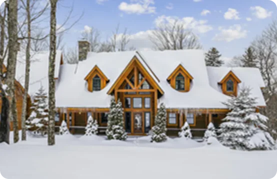 Escape to a private cabin set amid snow-covered pines in Vermont.