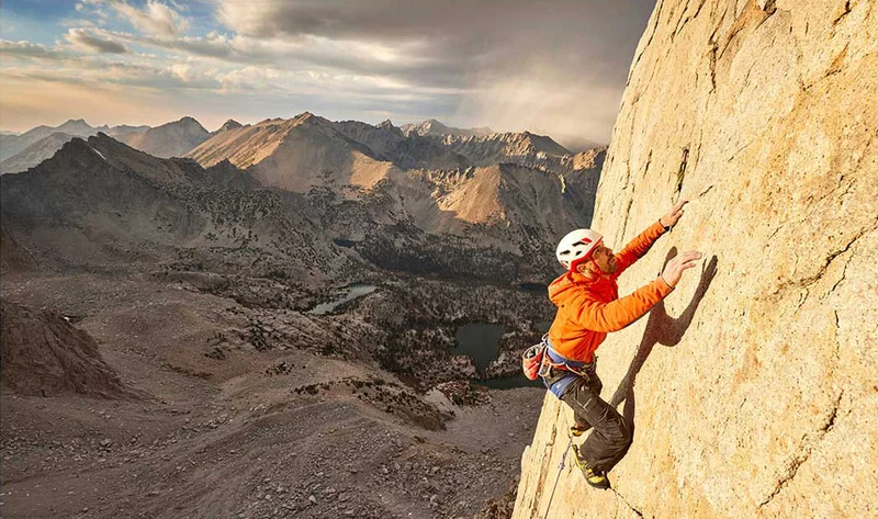 A person climbing on a rock wall.