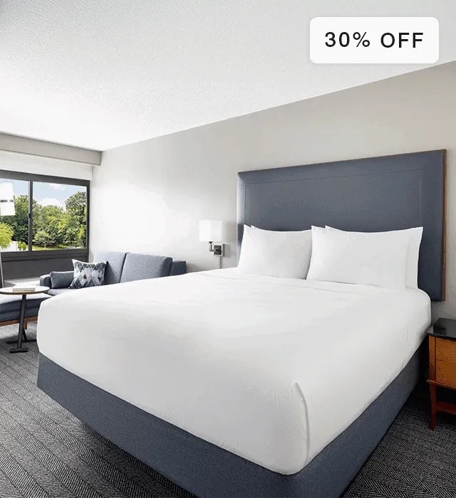 Animated gif of bare Courtyard mattress and made bed in deecorated room