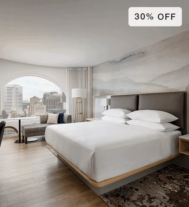 Animated gif of bare Marriott Hotels mattress and made bed in deecorated room