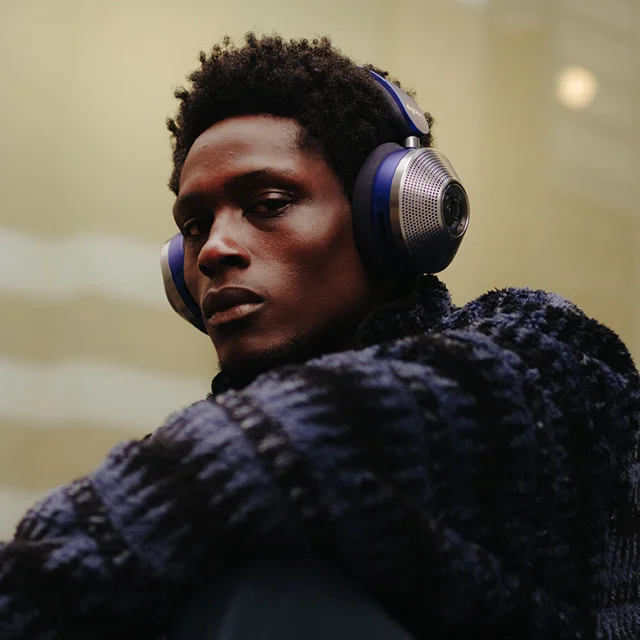 A man wearing the Dyson Zone noise-cancelling headphones