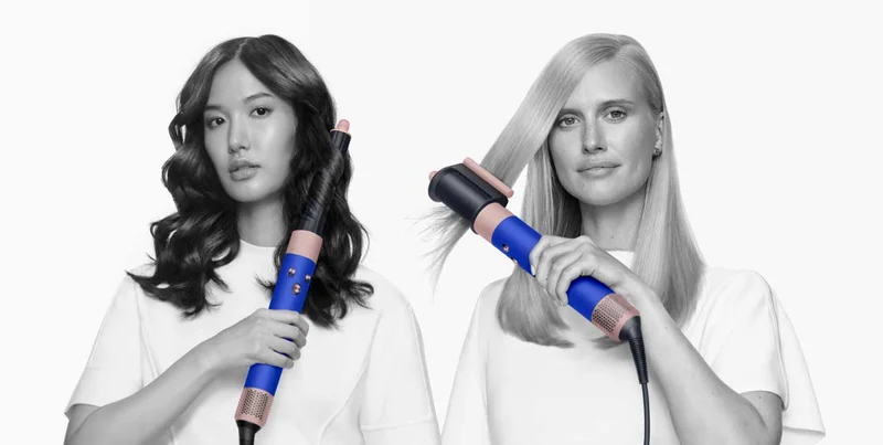 Models using the Dyson Airwrap multi styler to curl their hair