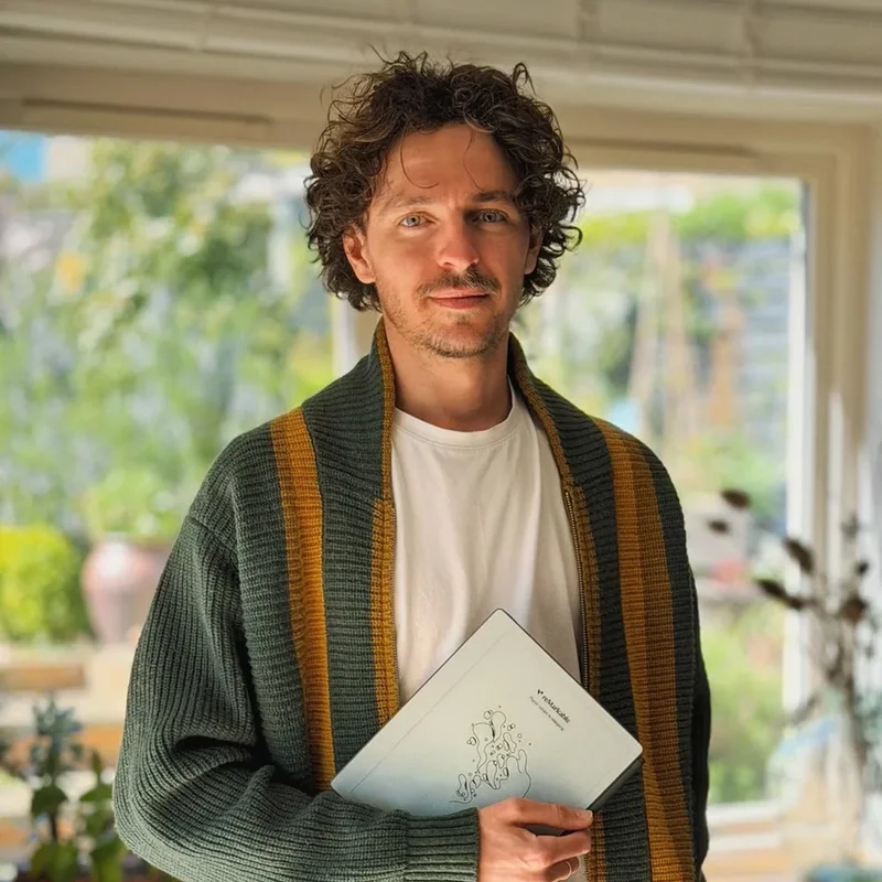 Man holding a reMarkable Paper Pure