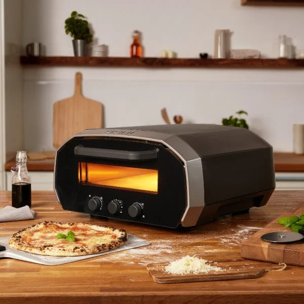 Ooni Volt being used inside on a counter top