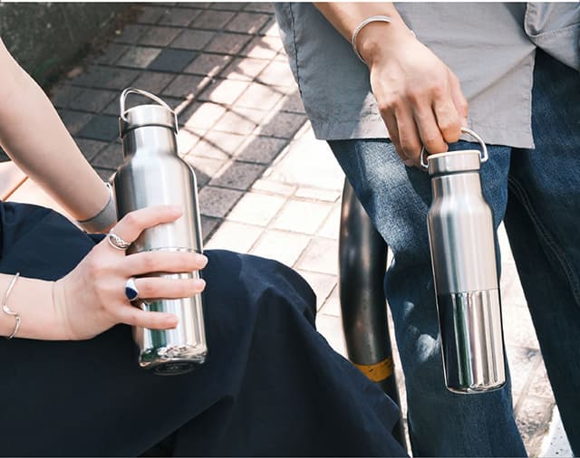 Rise Reflect bottle in hands