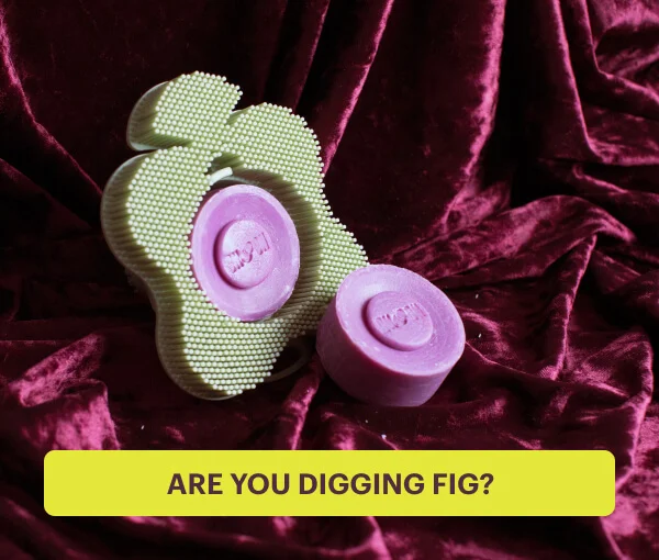 A sage Body Smoosh scrubber and two Fig bar soaps