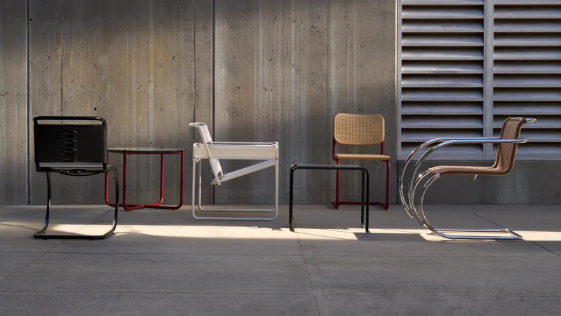 A collection of Knoll chairs and tables featuring the recent launch of three ultra-matte finishes—white, onyx, and an archival dark red.