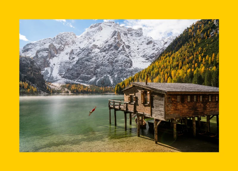A person dives into Lago di Braies (Lake Braies) in the Tyrol.