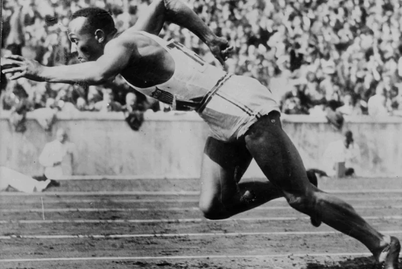 A vintage photo of an athlete sprinting