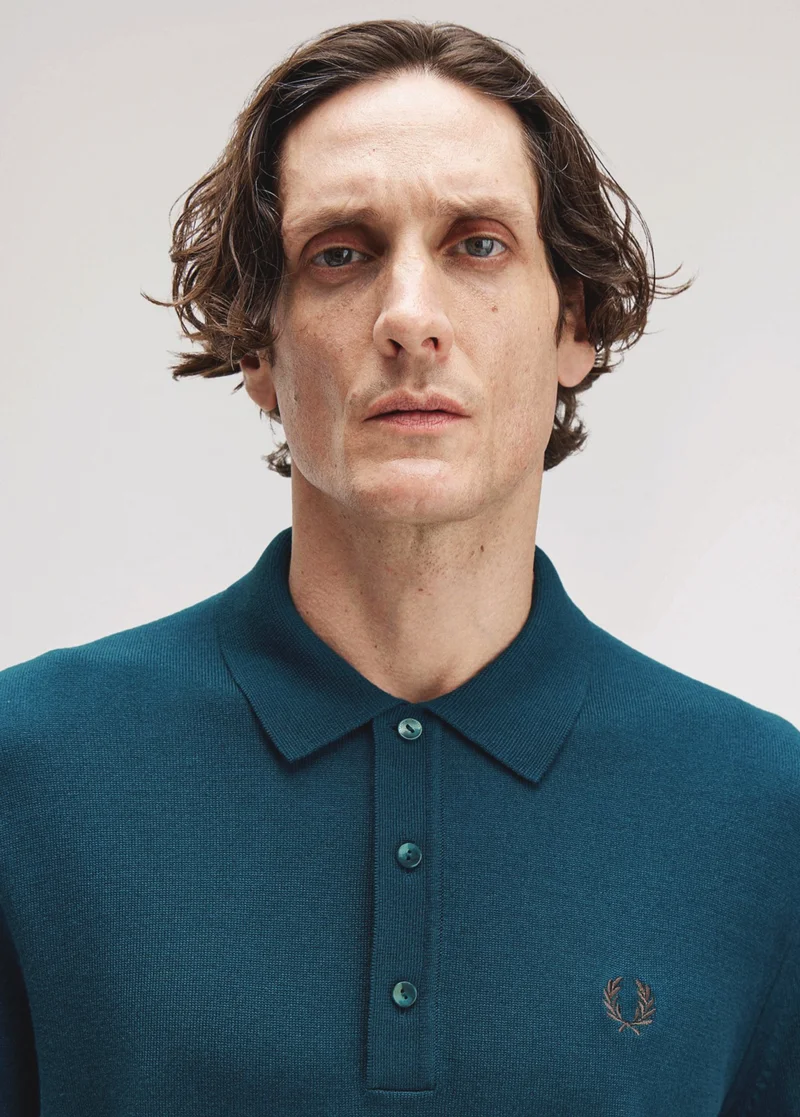 White male model wearing a M6000 Fred Perry Shirt in Dark Petrol / Shaded Stone