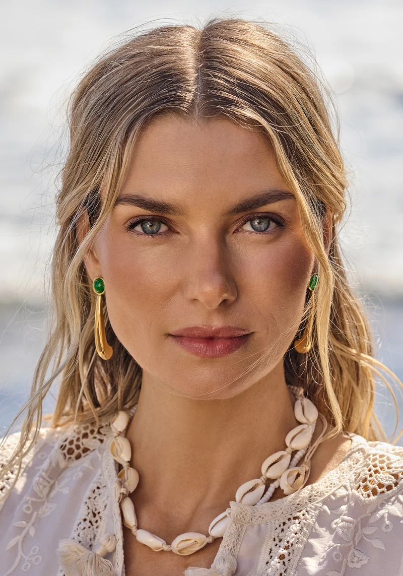 The Fiesta Capsule Long Lluvia Beaded Earrings in Gold with Green Beads.