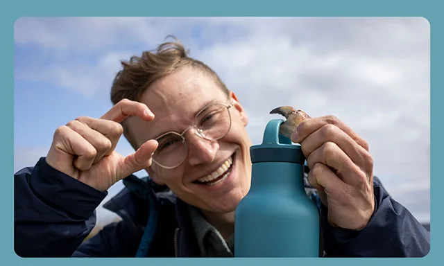 Brittany Blue - guy holding bottle
