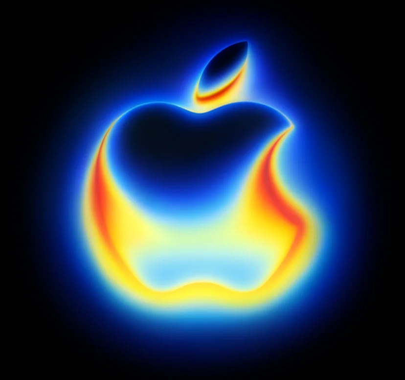 The Apple logo glowing in heat map thermal colors, morphing from blue into yellow into red, on a black backdrop. The heat map changes colors as it is interacted with. The longer the cursor hovers over the logo, the more red it becomes.