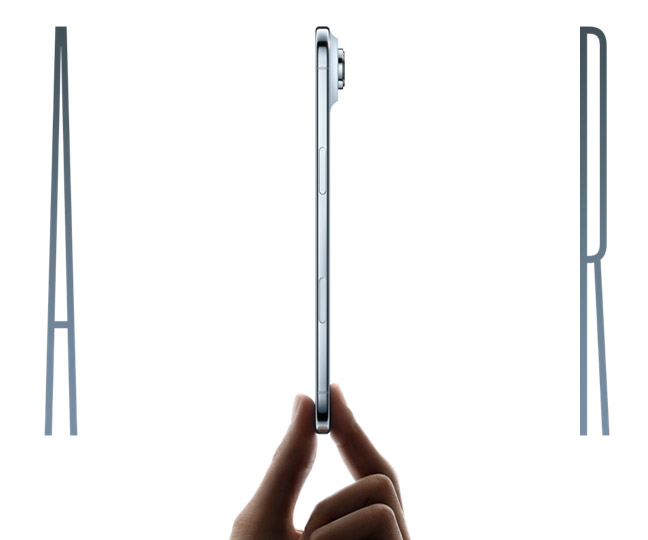 The word Air, spelled in thin chrome-colored letters. The I in Air is a side view of an iPhone Air device in Cloud White being held upright between the thumb and pointer finger of a hand. The side view of the iPhone Air shows a button and part of a camera peeking out from the top right.