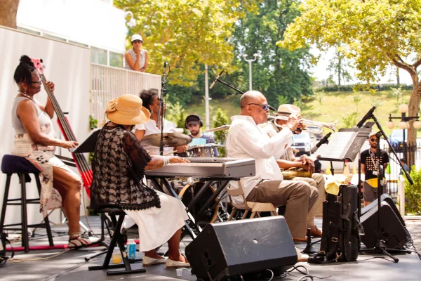 A photograph of a band performing outside of the Museum
