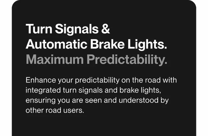 UNIT 1 Smart Helmet at night with integrated turn signals and automatic brake lights activated.