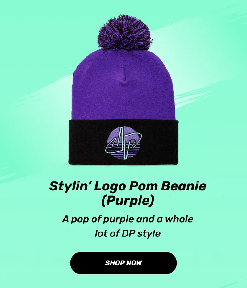 Stylin’ Logo Pom Beanie (Purple) | A pop of purple and a whole lot of DP style | CTA: Shop Now