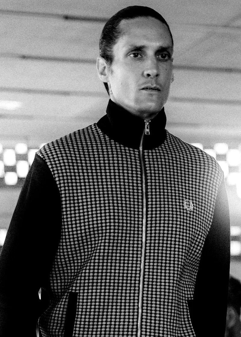 Model wearing a Fred Perry Knitted Front Track Jacket in Black