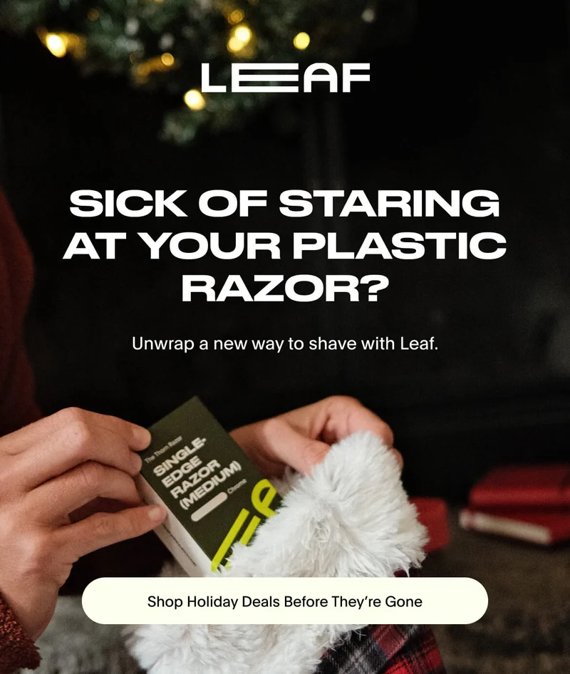 Person pulling out a single-edge razor from a sock.