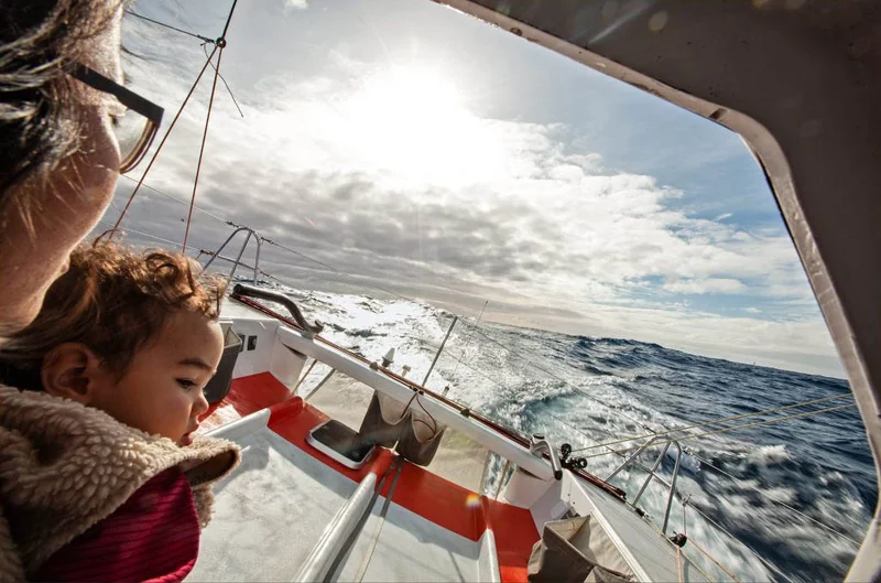 A person and a baby on a boat.