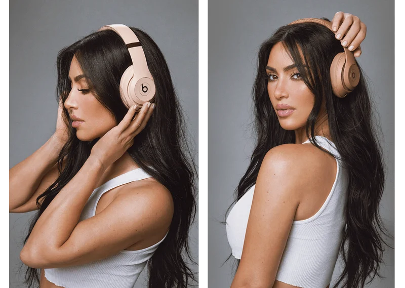 Kim Kardashian wearing Beats Studio Pro headphones in Moon and Dune