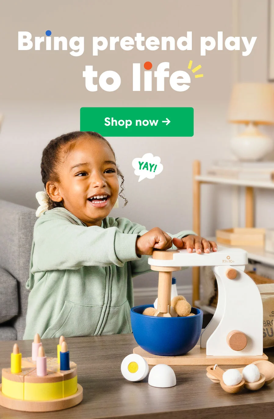 A child playing with a wooden pretend play kitchen set. Text: ''Bring pretend play to life.''