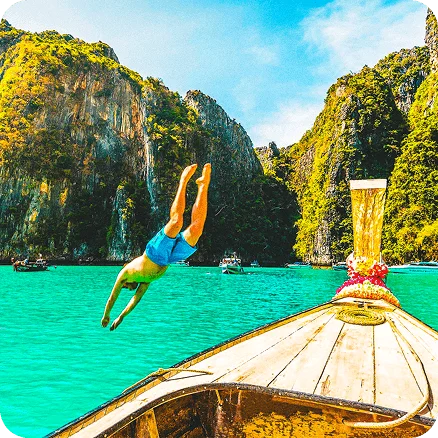 Image Description: A person diving off a boat into the water.