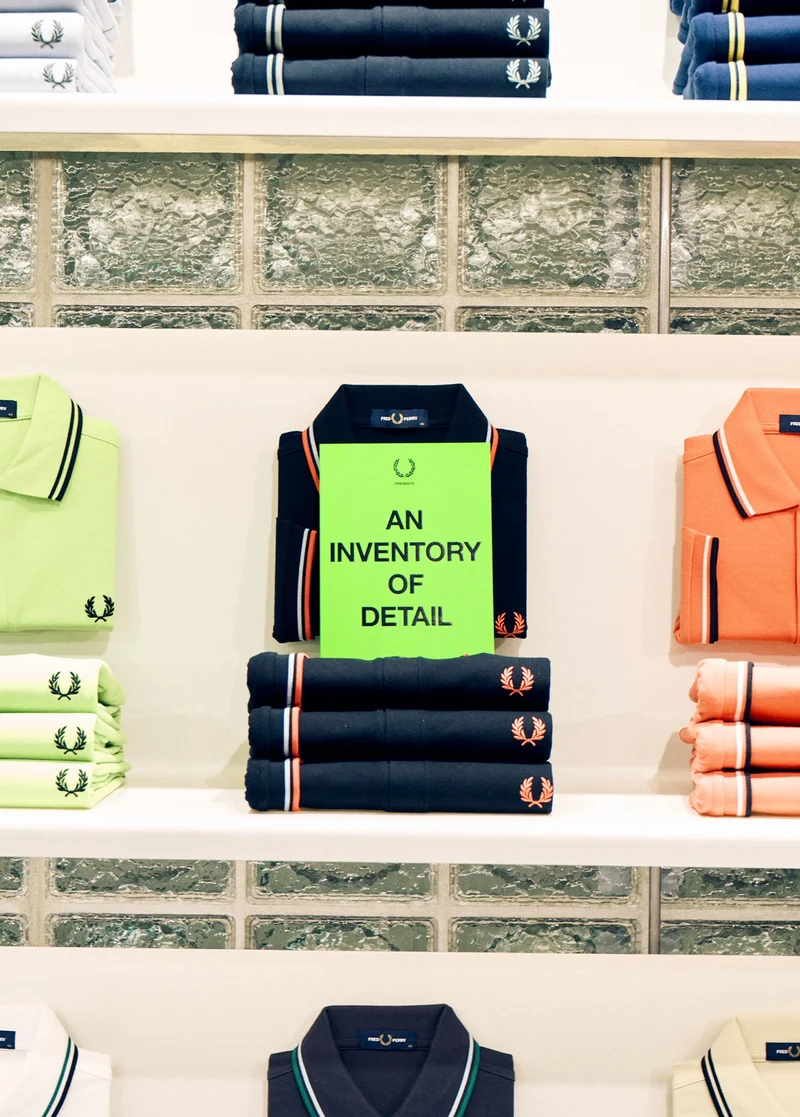 The Fred Perry Shirt Wall in our Soho Store with a copy of An Inventory of Detail Zine