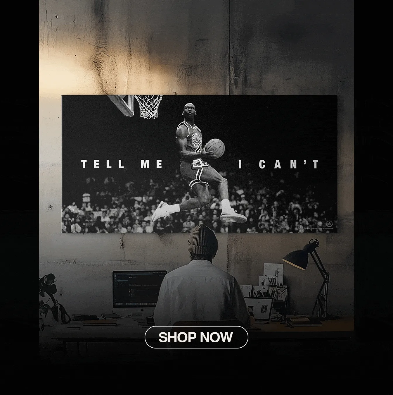Animated GIF of a man at a desk looking at a Michael Jordan canvas that reads “Tell Me I Can’t,” with a flashing Shop Now button.