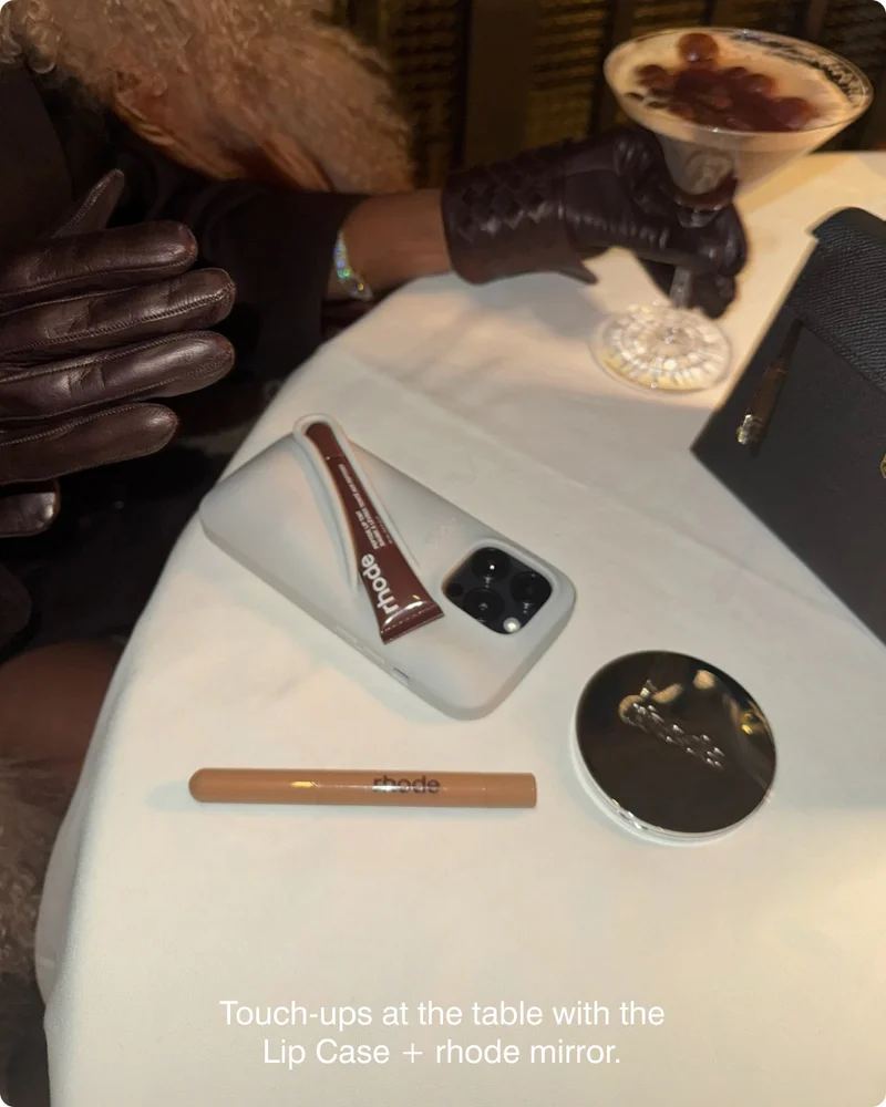 Touch-ups at the table with the Lip Case + rhode mirror.
