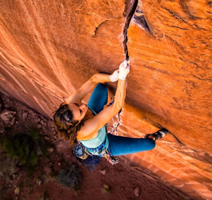 Pro climber Steph Davis climbing 'Hidden Gem' near Moab Utah.