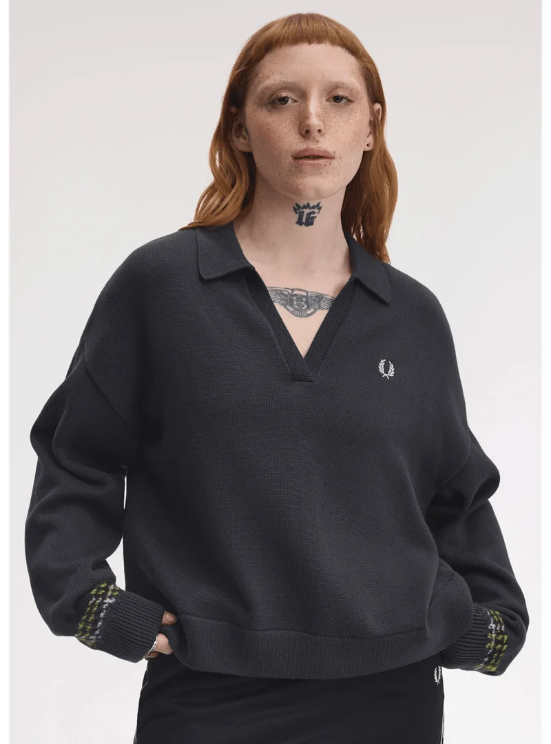 A female model wearing a Tartan Panel Knitted Shirt in Anchor Grey