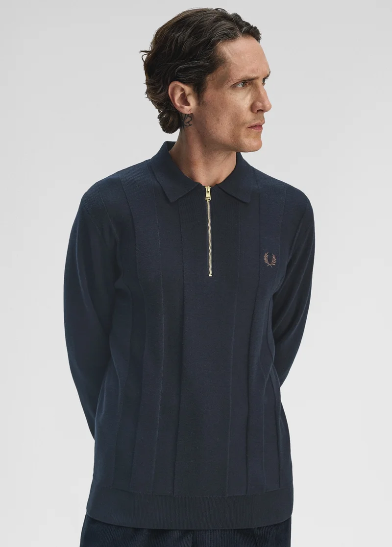 Male model wearing a Fred Perry Tonal Stripe Knitted Shirt in Navy