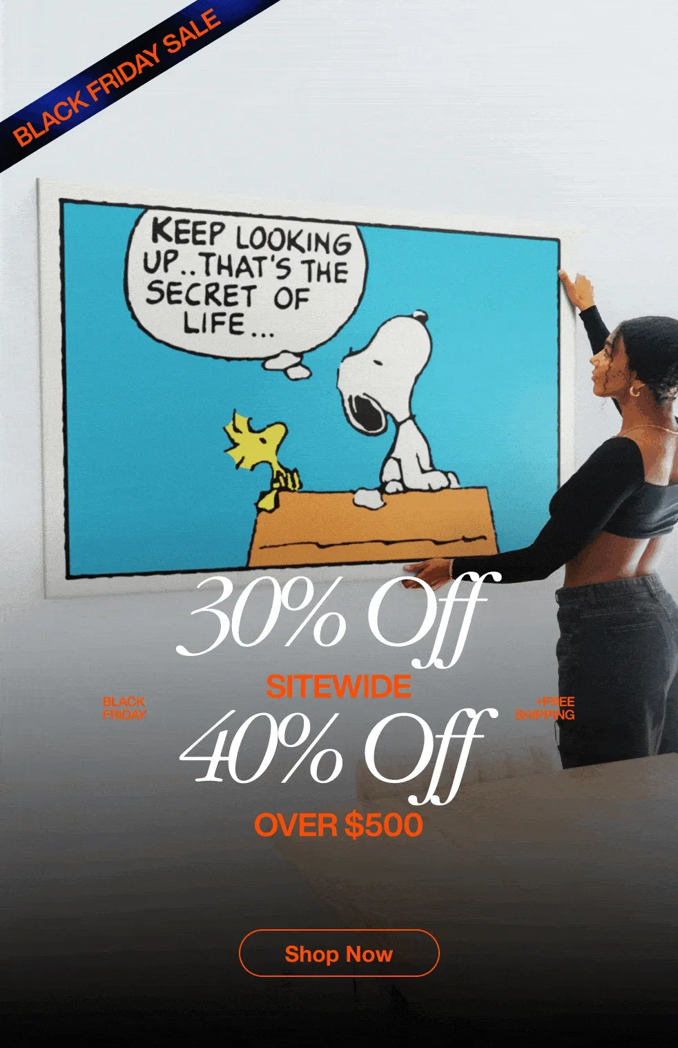 Black Friday Sale promotional GIF showcasing various IKONICK canvas art pieces displayed in stylish home interiors. Each frame features a different motivational artwork — including Snoopy and Woodstock saying ‘Keep Looking Up,’ Tiger Woods celebrating with the quote ‘Give Everything,’ Michael Jordan mid-dunk with ‘Tell Me I Can’t,’ a vintage scoreboard reading ‘Yesterday’s Hits Won’t Win Today’s Games,’ the Roman Colosseum piece titled ‘Man in the Arena,’ and the Monopoly-inspired artwork labeled ‘Success – Price of Entry.’ Overlaid text highlights ‘30% Off Sitewide’ and ‘40% Off Over $500 + Free Shipping,’ with a ‘Shop Now’ button at the bottom.