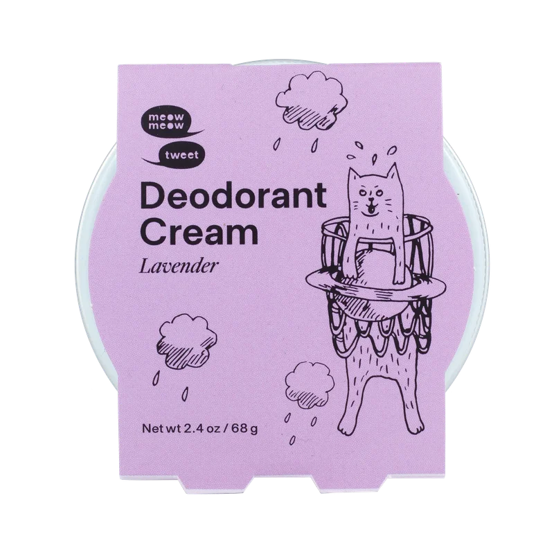 A metal tin of deodorant cream with a lavender colored paper sleeve.