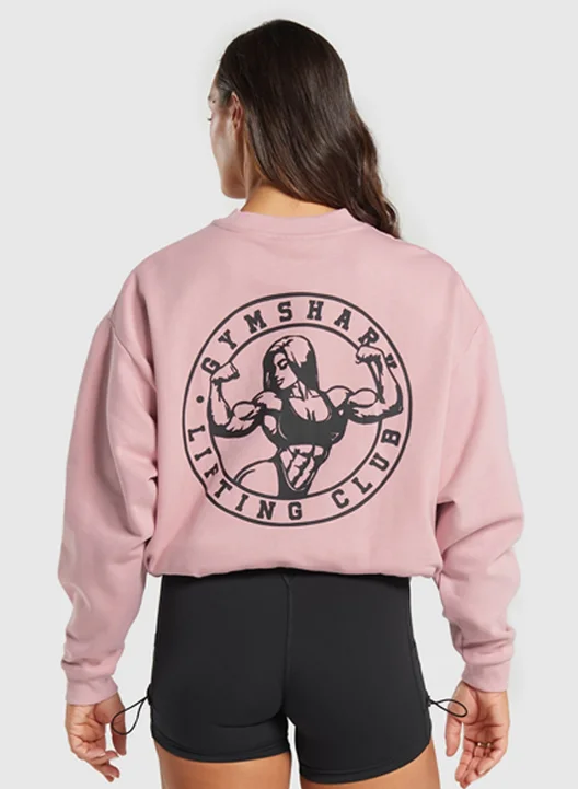 STRONG GIRL LIFTING CLUB OVERSIZED GRAPHIC CREW. LIGHT PINK.